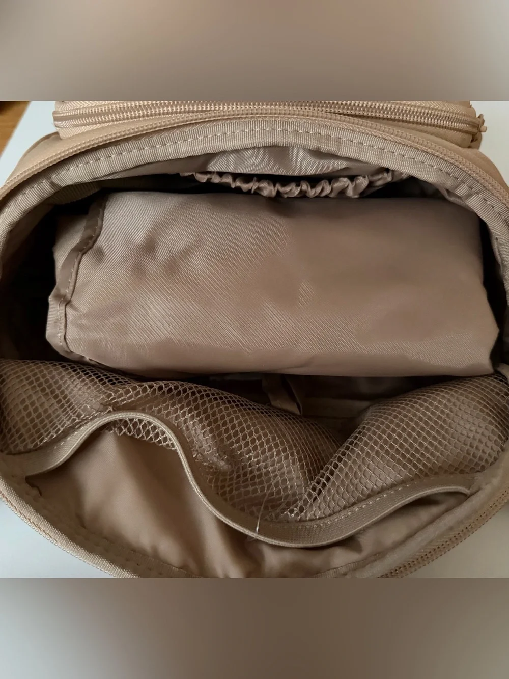 Cloud Island diaper sling in tan with checkered strap